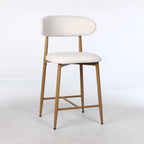 Set of two beige upholstered counter height bar stools with mid-century modern metal frames